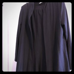 2 piece black skirt suit. Skirt is long. Size L/XL